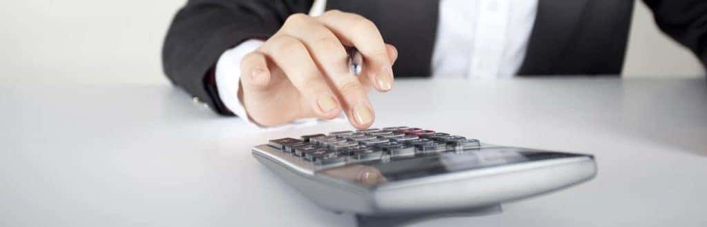 Hand Typing Numbers on a Calculator