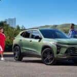 A 2024 Chevy Trax in green surrounded by 3 passengers.