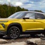 2024 Chevy Trailblazer near a lake and a wooded area