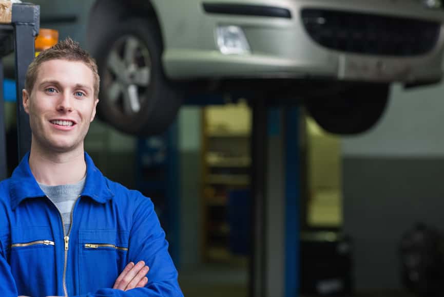 Auto mechanic in workshop