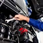 Car mechanic working on car