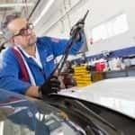 Senior mechanic working on windshield wipers