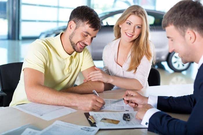 A couple extending their BMW lease