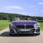 A front view of a 2023 BMW Z4 driving down a country road
