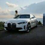 BMW i4 charging by the ocean