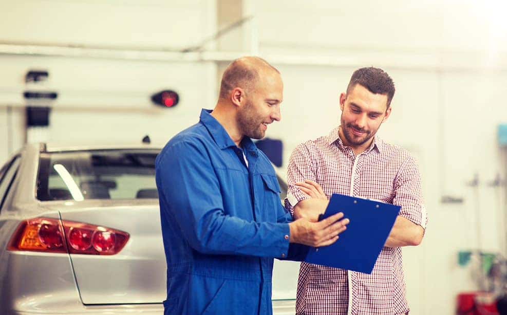 Mechanic talking to a client