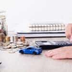 Calculating BMW financing with a toy car and coins
