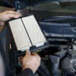 Changing engine air filter as part of a BMW service schedule
