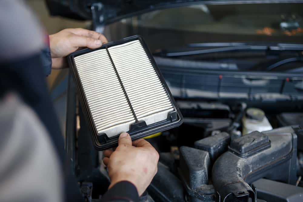 Changing engine air filter as part of a BMW service schedule