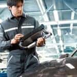 Service technician inspecting BMW warranty coverage