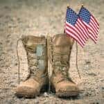 Combat boots with American flags representing the BMW military discount