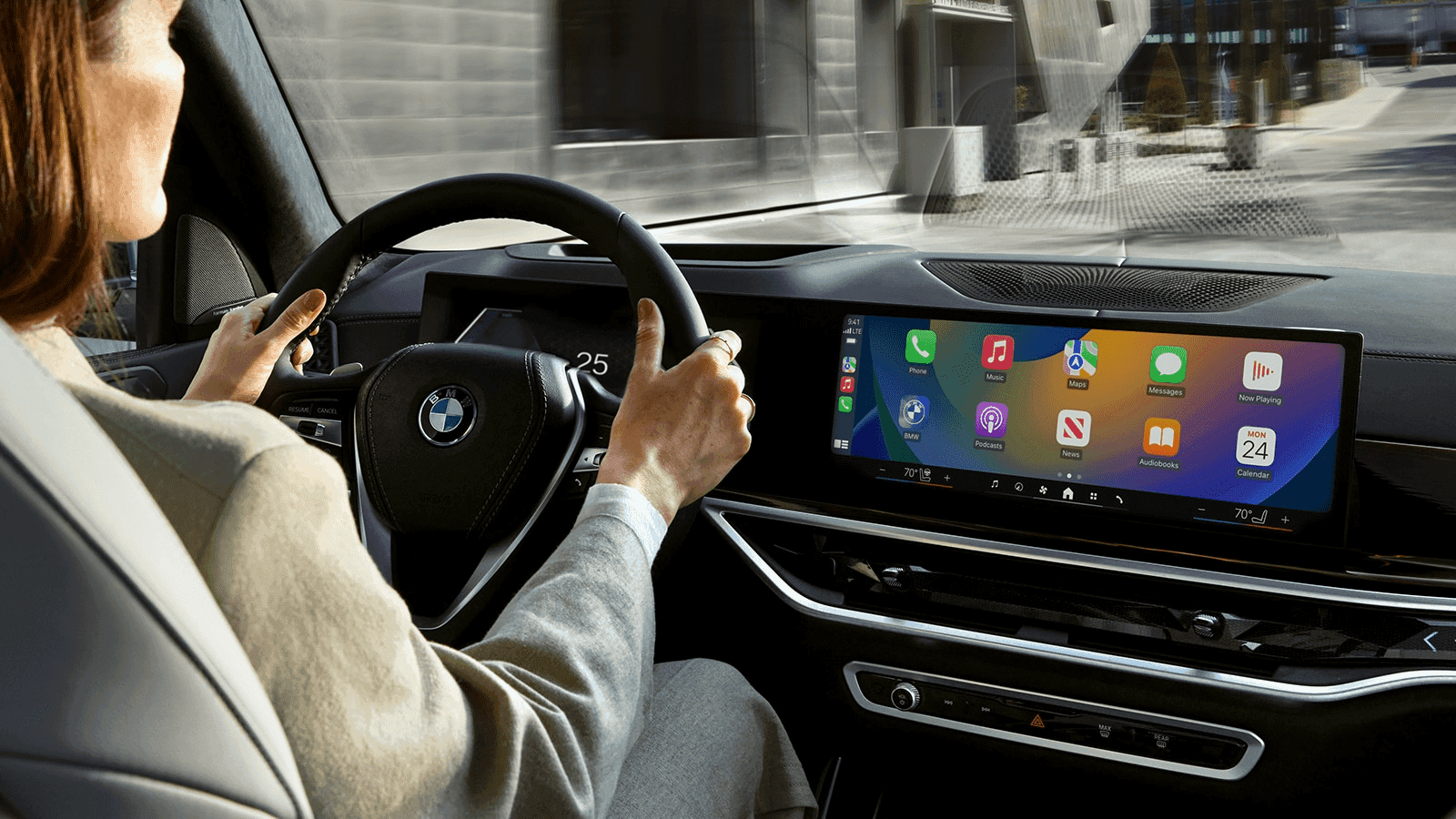 Driver behind the wheel of a vehicle equipped with BMW safety features