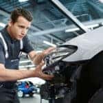 Technician performing a BMW Vehicle Check