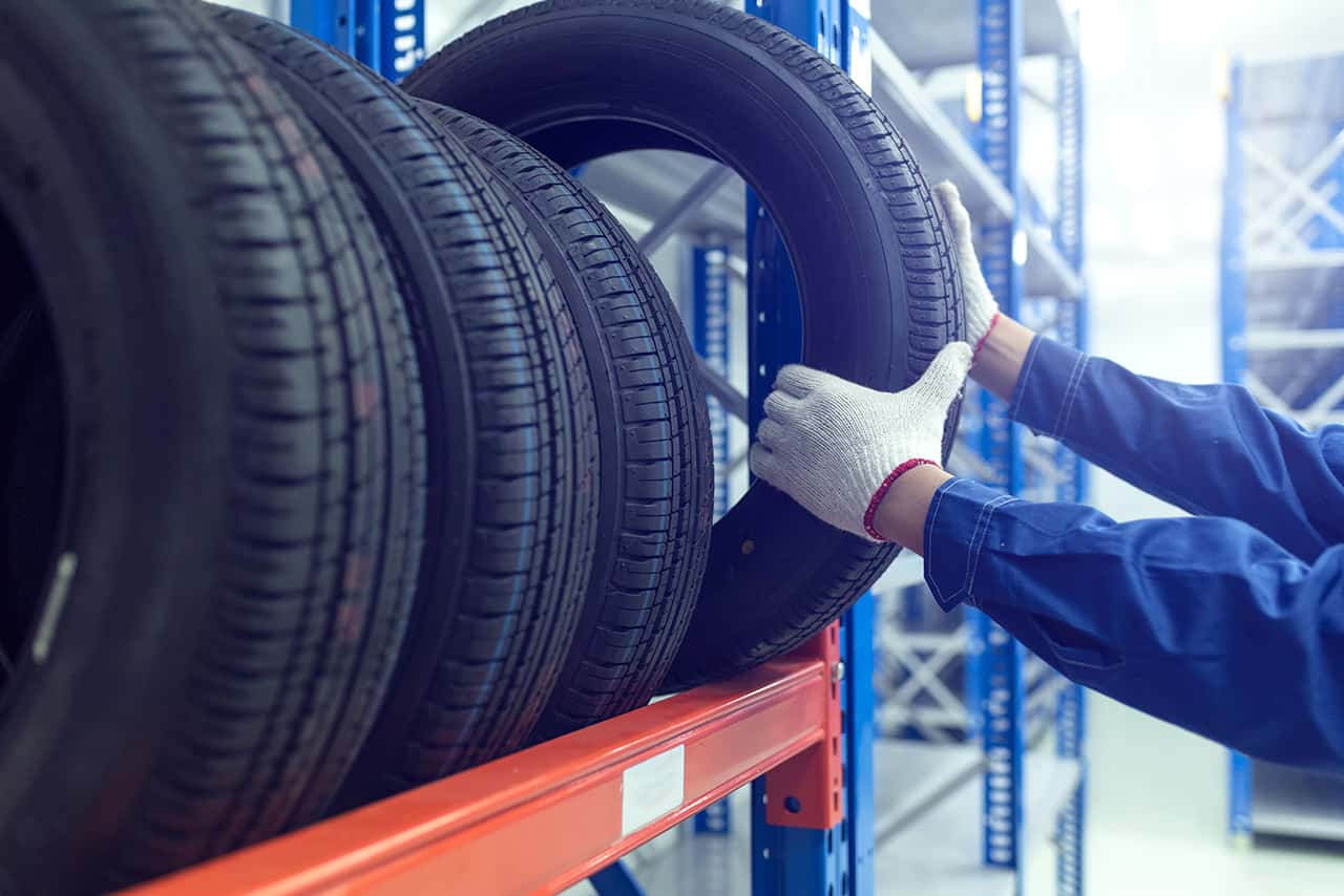 Service technician picking out new BMW tires