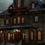 an old, broken down, and decrepit manor haunted house framed by a giant, bright, white full moon for the Halloween season