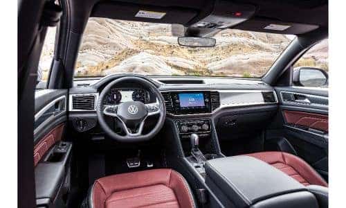 2020 Volkswagen Atlas Cross Sport interior shot of front seating red leather upholstery and dashboard design and layout