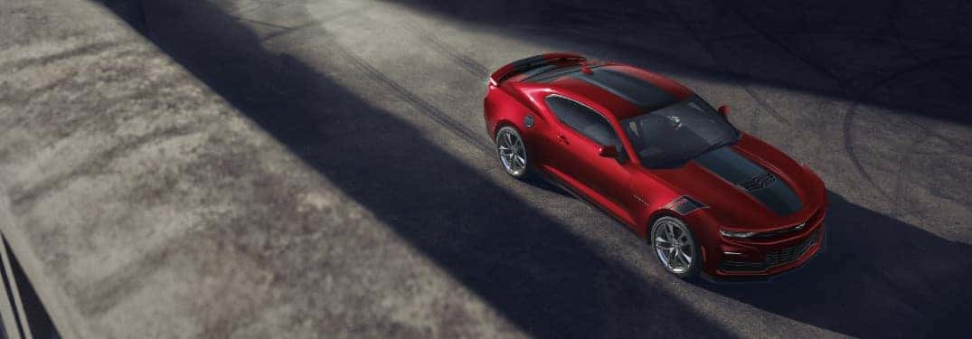 2021 Chevy Camaro exterior overhead shot with red and black paint color parked on concrete in shadows