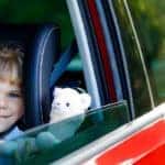 little girl sitting in car