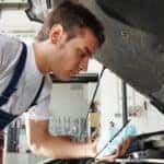 mechanic working on vehicle