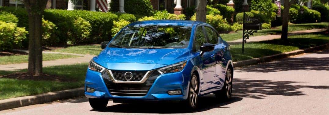 2021 Nissan Versa driving down a city street