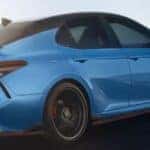 2022 Toyota Camry driving down a rural road