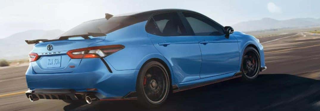 2022 Toyota Camry driving down a rural road