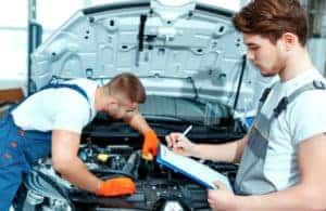 Mechanics checking out a vehicle