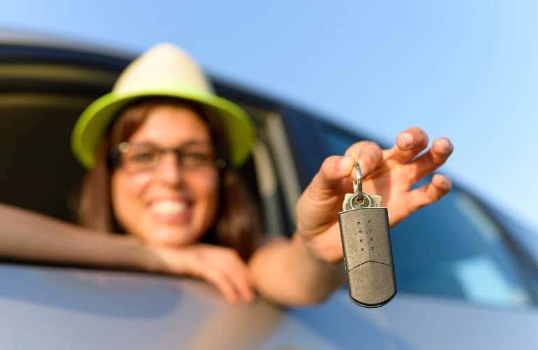 a woman with keys in her hand