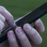 two hands holding a cell phone