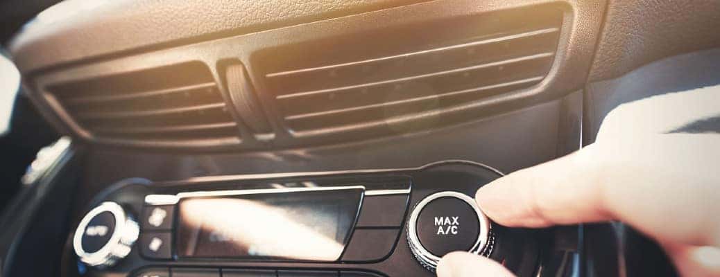 air conditioning vents with a hand