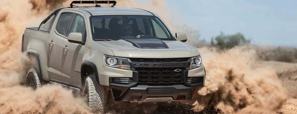 Chevrolet Colorado driving through sand