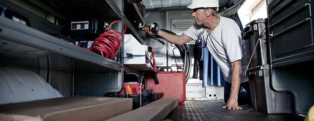 2023 GMC commercial truck with a worker inside