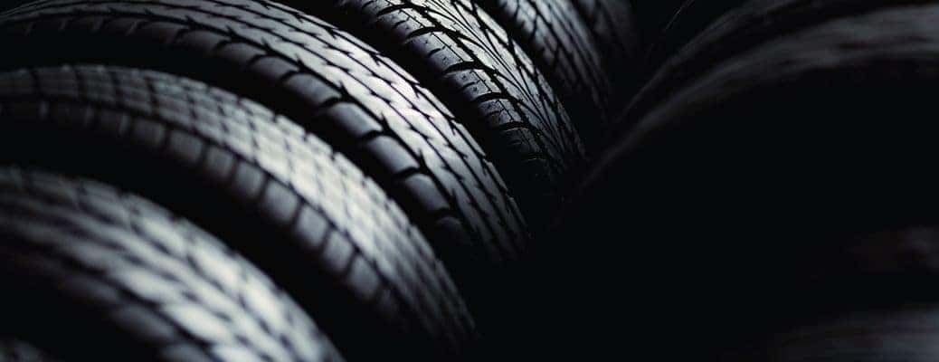 close up of several vehicle tires in a row