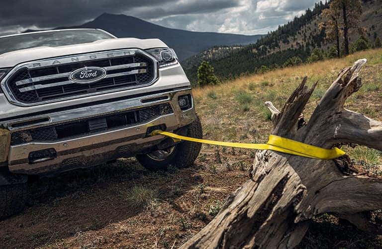 2022 Ford Ranger pulling a log with a yellow rope