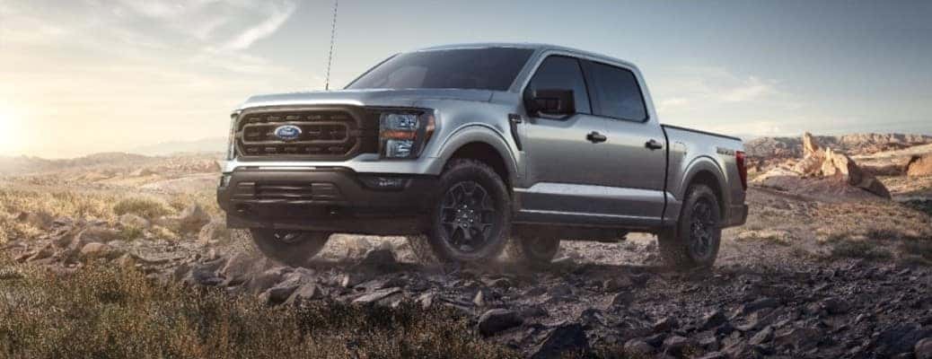 2023 Ford F-150 driving on rocks