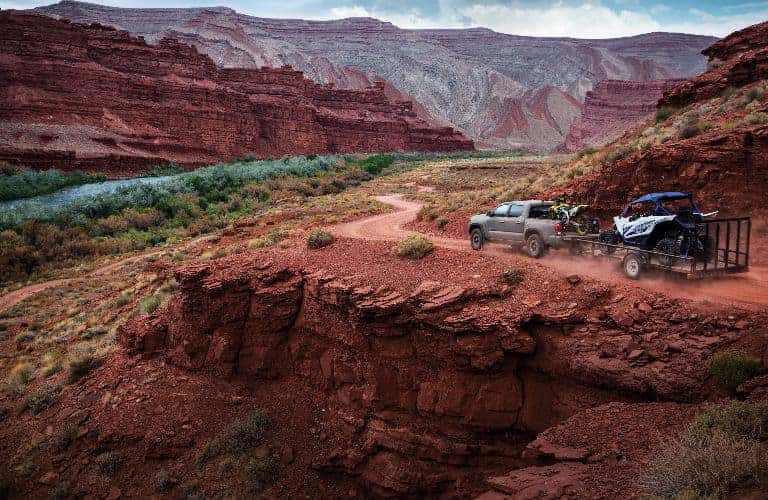 2018 Toyota Tacoma driving through a mountain range