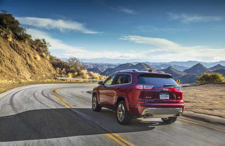2020 Jeep Cherokee on a road by a hill