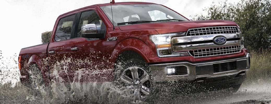 2020 Ford F-150 truck driving in dirt