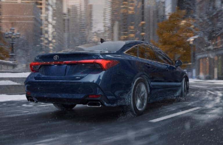 rear view of a blue 2021 Toyota Avalon AWD on a road
