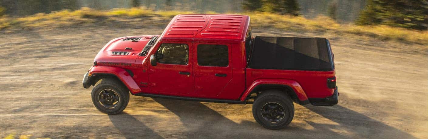2020 Jeep Gladiator side view on a dirt path