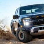 2024 Ford F-150 Raptor driving through sand