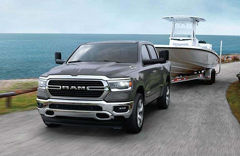 2020 Ram 1500 front view towing a boat