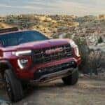 2024 GMC Canyon driving up a hill