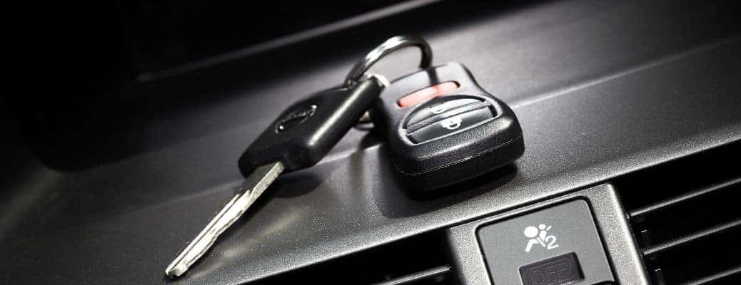 keys resting on a car's dashboard