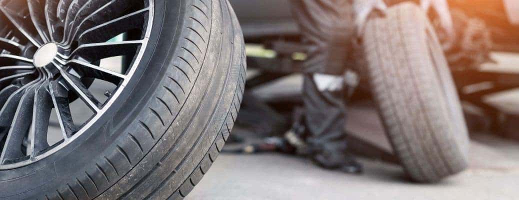 Tires by a car at a dealership service center