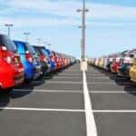 a parking lot full of colorful cars