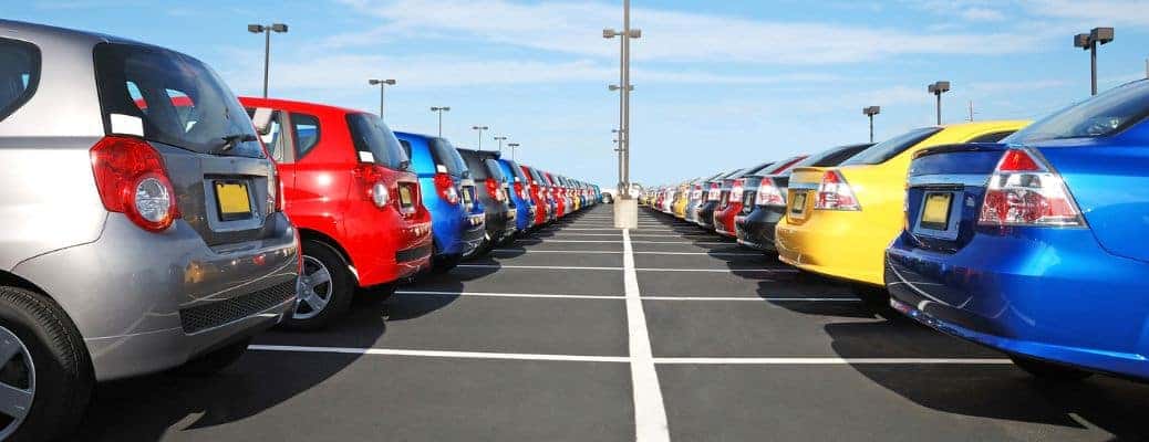 a parking lot full of colorful cars