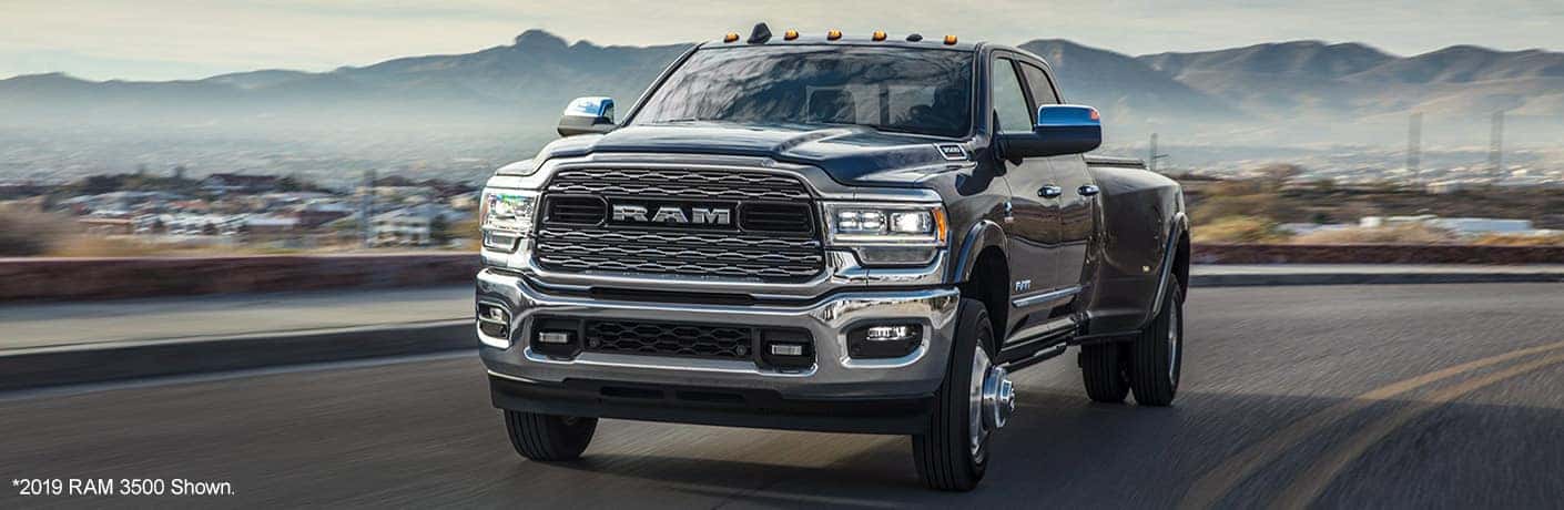 2020 Ram 3500 truck on a road in front of mountains