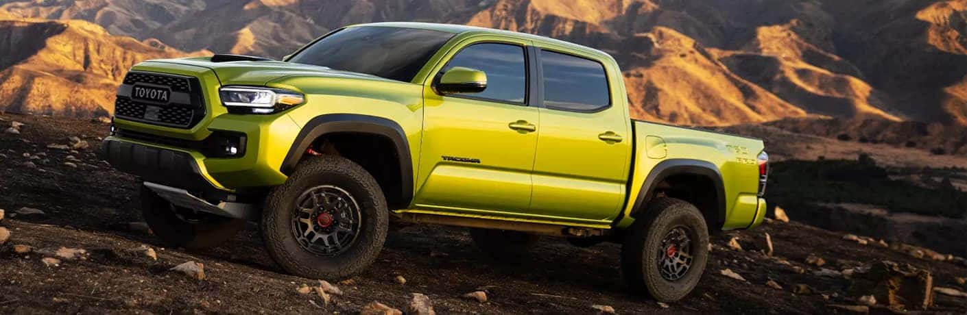 2022 Toyota Tacoma driving on a rocky hillside