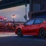 2023 Toyota Camry side and back view under a bridge